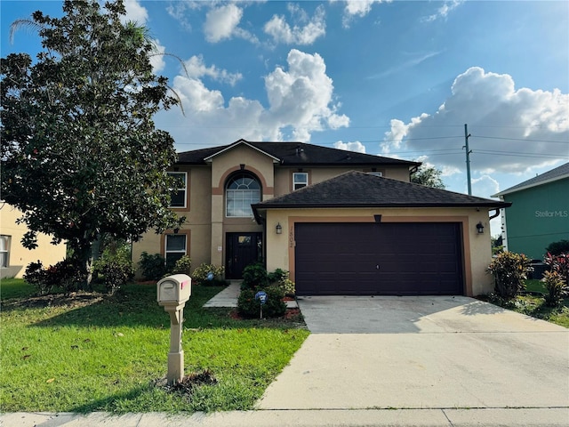 view of front of house with a garage and a front lawn