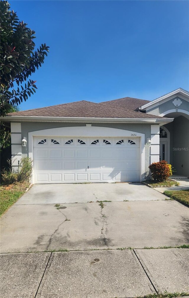 view of side of property featuring a garage