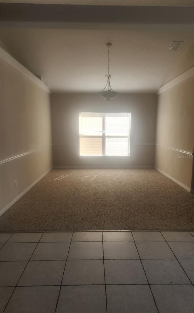 unfurnished room with carpet floors