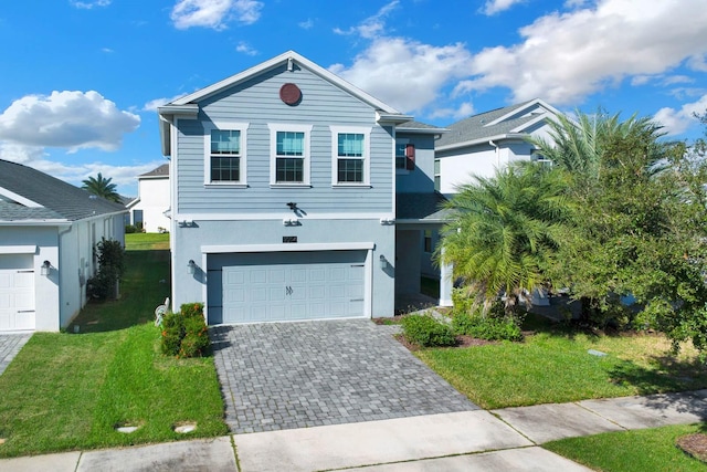 front of property featuring a garage and a front yard