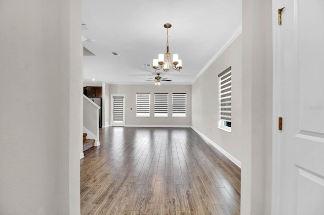 unfurnished living room with hardwood / wood-style floors, ceiling fan with notable chandelier, and ornamental molding