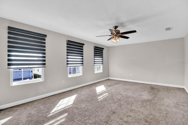 unfurnished room with carpet and ceiling fan