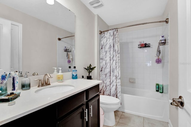 full bathroom with tile patterned flooring, shower / tub combo, vanity, and toilet