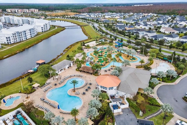 birds eye view of property with a water view