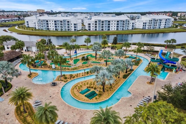 view of swimming pool with a water view