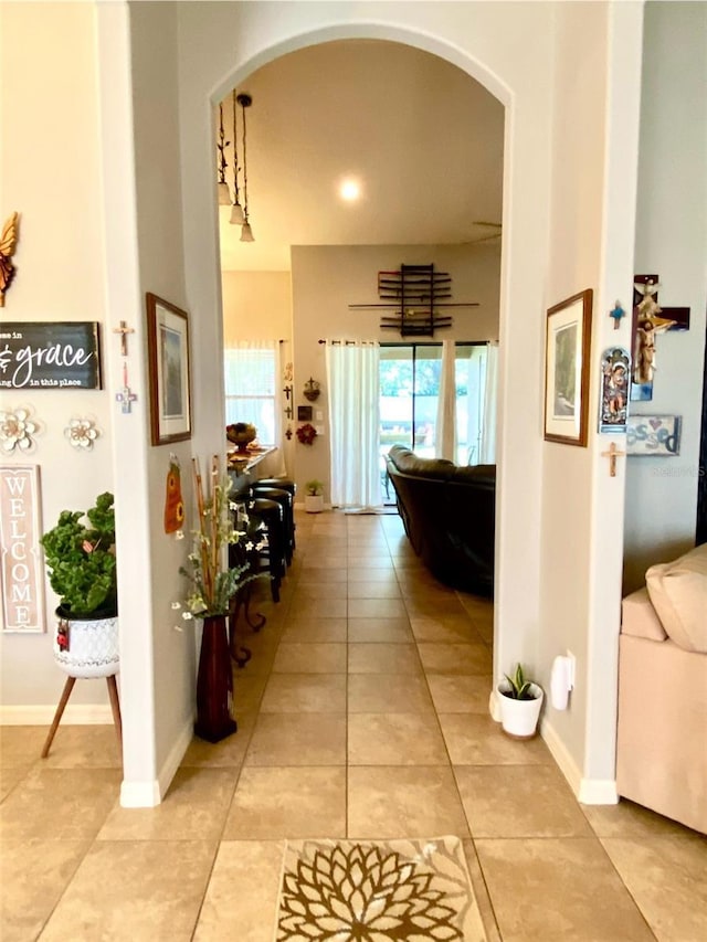 hallway with light tile patterned floors