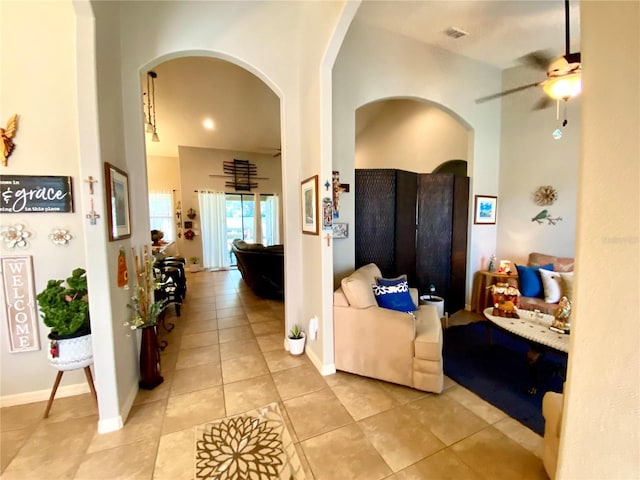 hall with light tile patterned floors