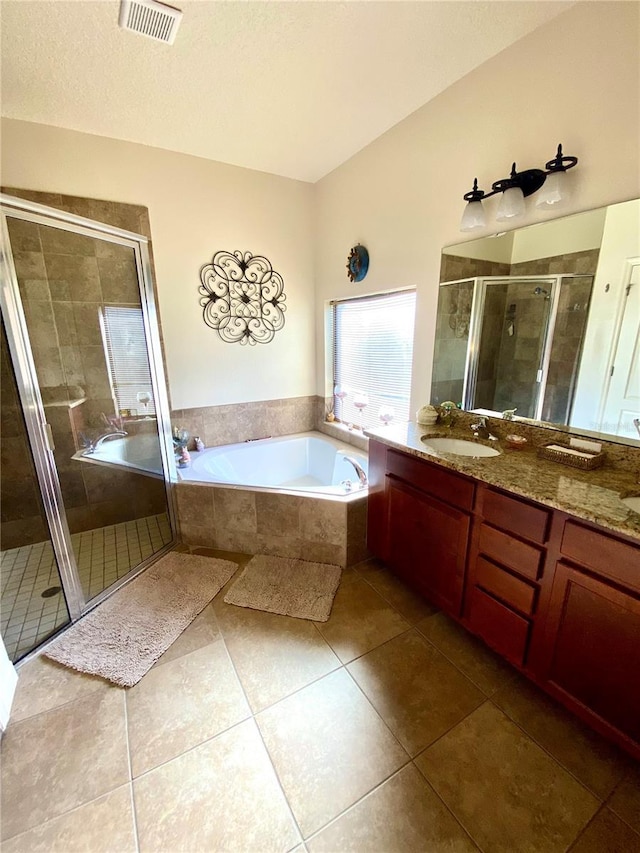 bathroom with shower with separate bathtub, vanity, and tile patterned floors