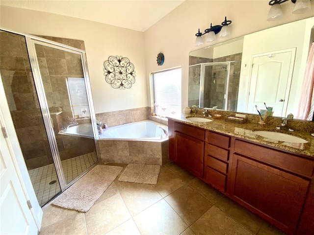 bathroom with tile patterned floors, vanity, and separate shower and tub