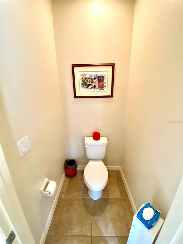 bathroom with tile patterned floors and toilet