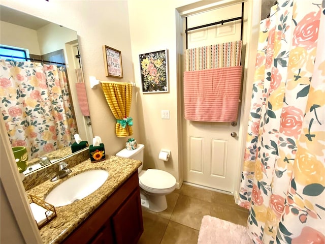 bathroom featuring tile patterned flooring, vanity, a shower with shower curtain, and toilet