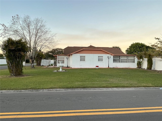 view of front of home with a lawn