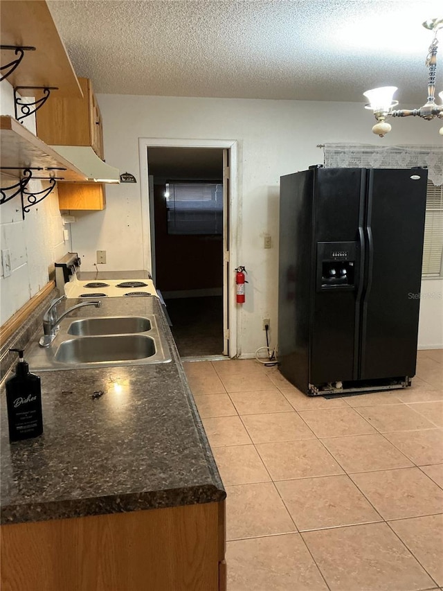 kitchen featuring sink, white electric range, a textured ceiling, black fridge with ice dispenser, and light tile patterned flooring