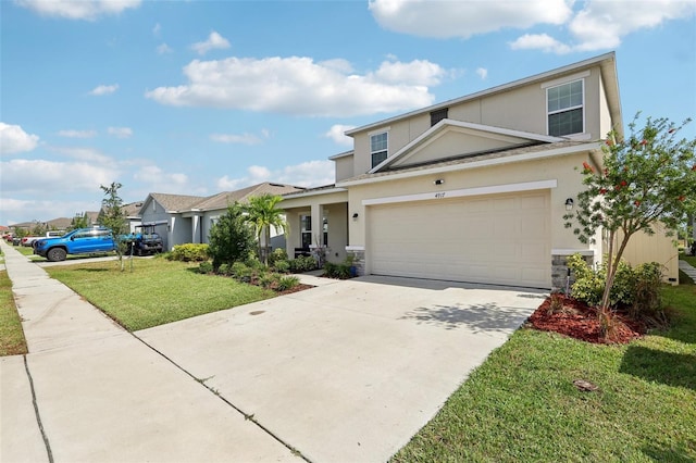 view of front of house featuring a front lawn and a garage