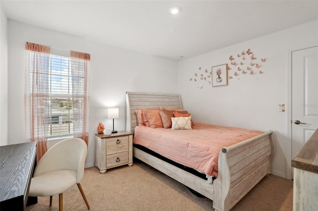 bedroom featuring light colored carpet