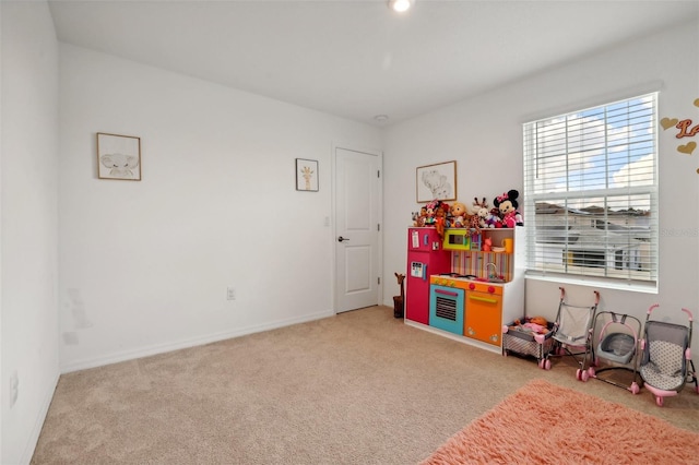 game room featuring light colored carpet