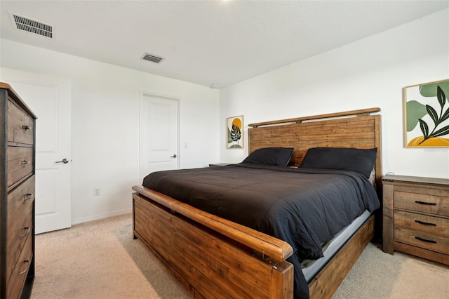 bedroom featuring light carpet