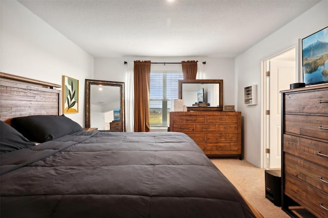 carpeted bedroom featuring a textured ceiling