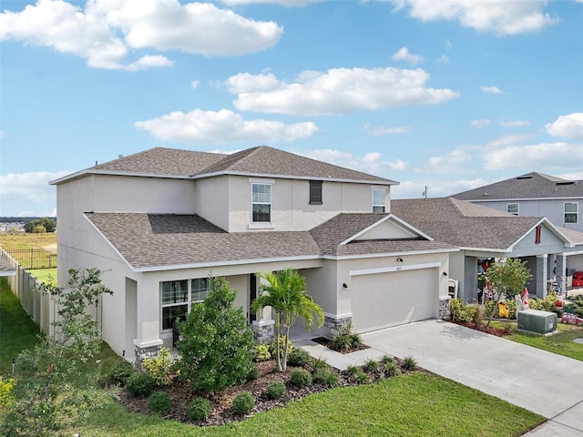 view of front of house with a garage and a front lawn