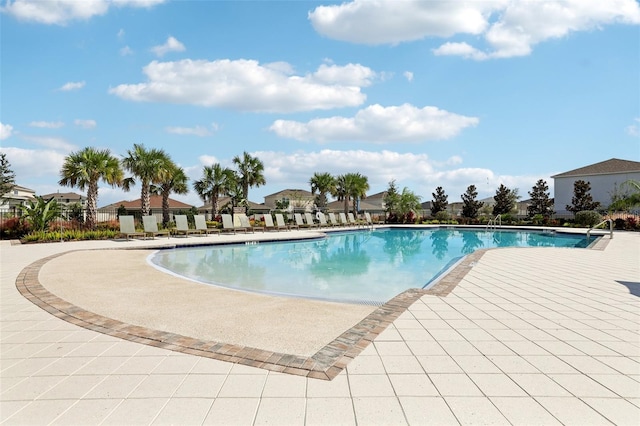 view of swimming pool featuring a patio area