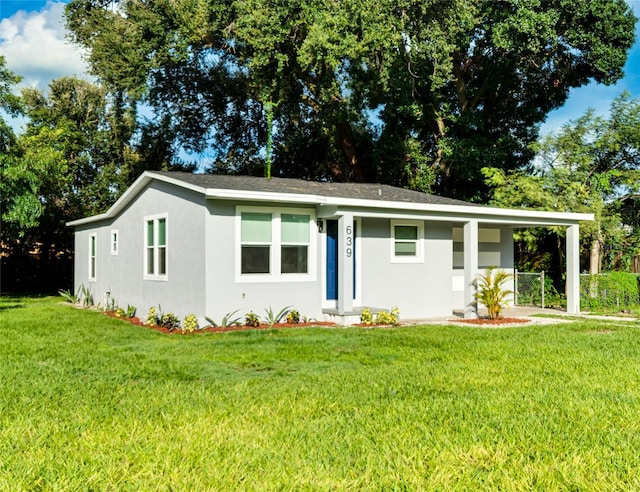 ranch-style home with a front yard