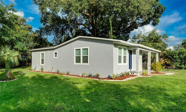 view of home's exterior featuring a yard