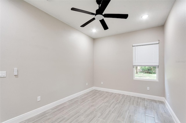 unfurnished room featuring light wood-type flooring and ceiling fan