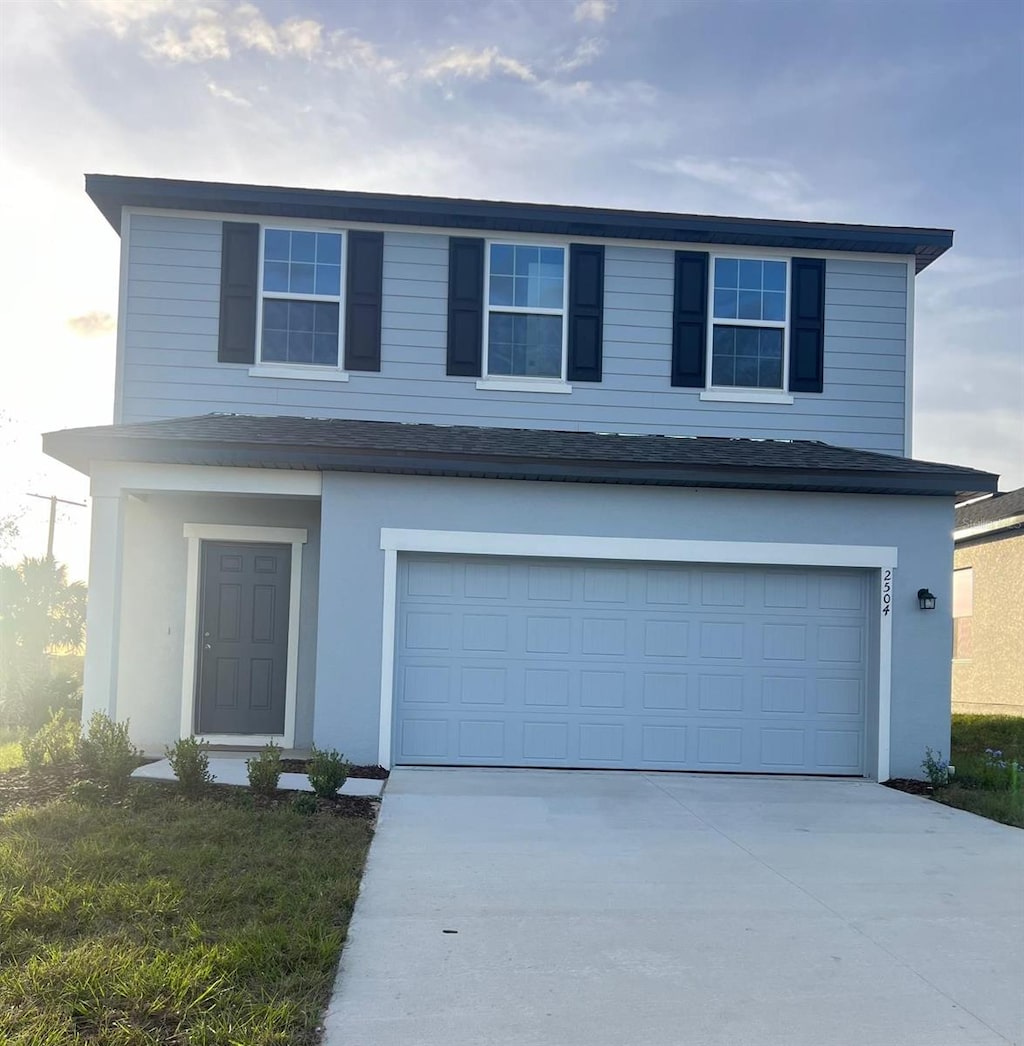 front of property featuring a garage