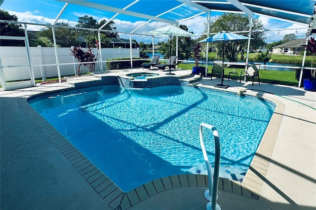 view of pool featuring glass enclosure, a patio area, and an in ground hot tub