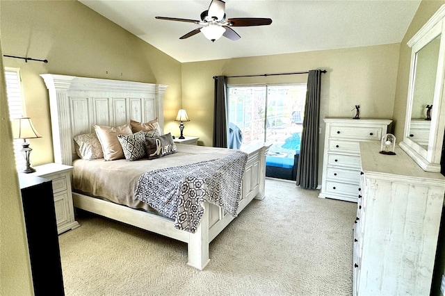 carpeted bedroom with ceiling fan, access to exterior, and vaulted ceiling