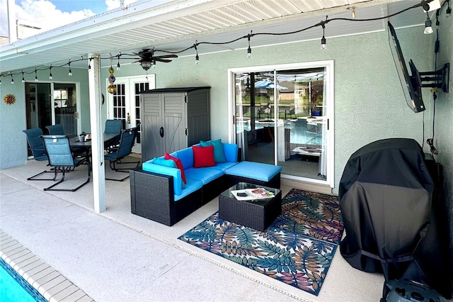 view of patio featuring an outdoor living space and ceiling fan