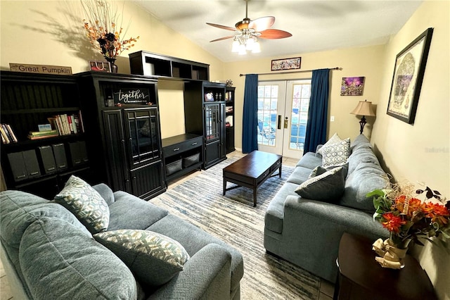 living room featuring ceiling fan, french doors, lofted ceiling, and hardwood / wood-style flooring