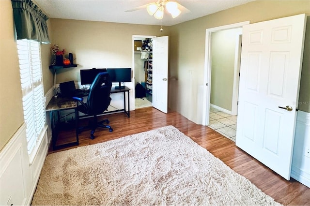 office area with ceiling fan and light hardwood / wood-style flooring