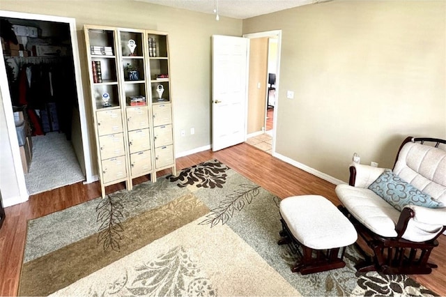 living area with wood-type flooring