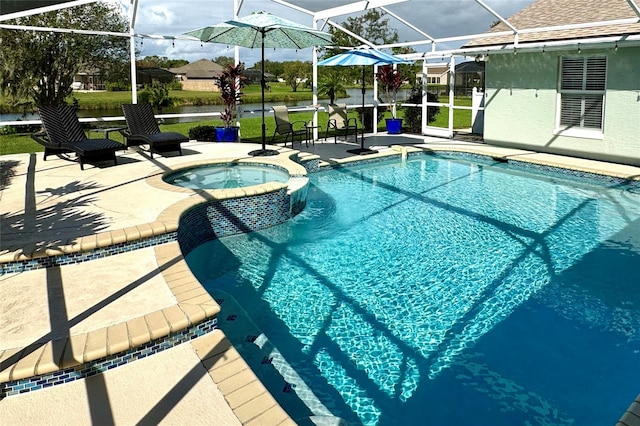 view of pool featuring glass enclosure, an in ground hot tub, and a patio