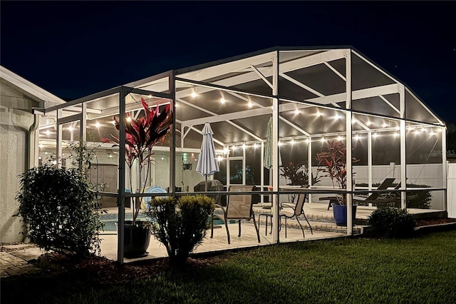 patio at twilight with a lanai