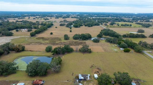 aerial view featuring a rural view and a water view