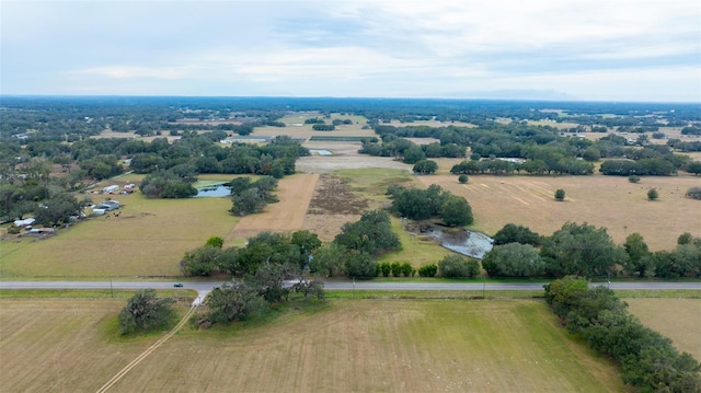 birds eye view of property with a rural view and a water view