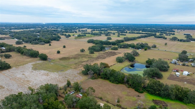 birds eye view of property with a water view and a rural view