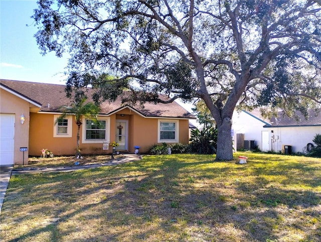 ranch-style house with central AC, a front yard, and a garage