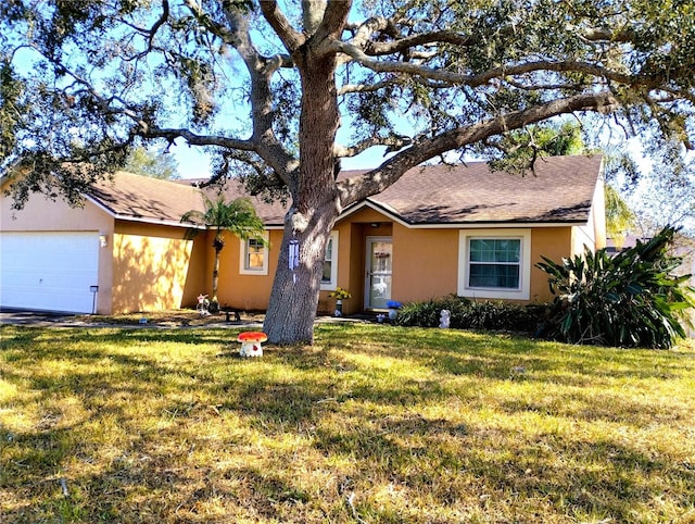 ranch-style home featuring a garage and a front lawn