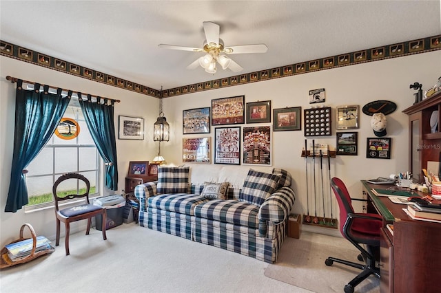 interior space featuring ceiling fan and carpet floors