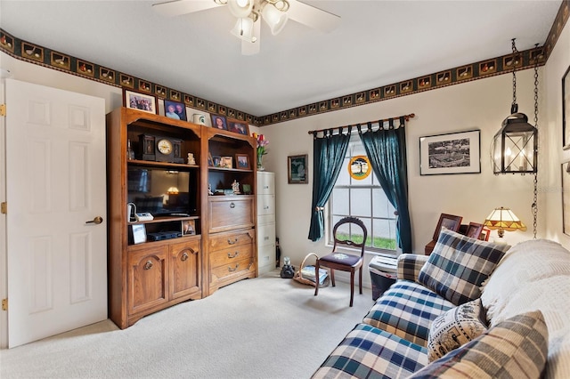 carpeted living room featuring ceiling fan