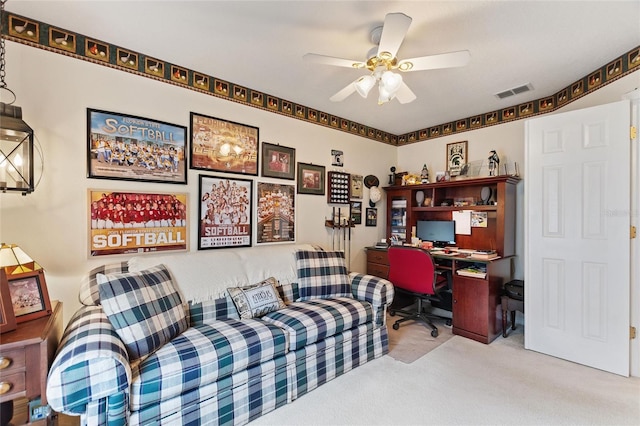 office area with ceiling fan and light colored carpet