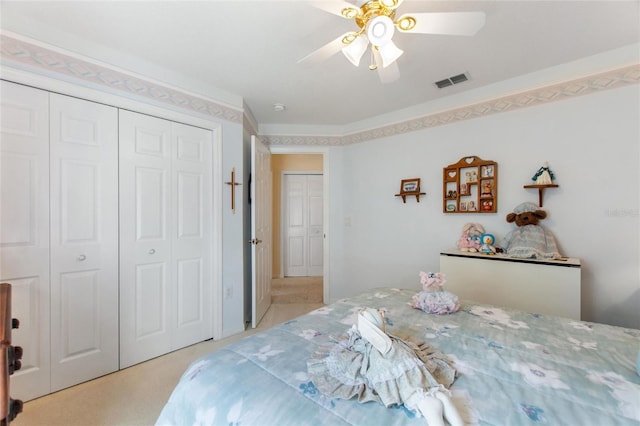 carpeted bedroom featuring ornamental molding and ceiling fan