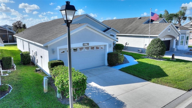 view of front of home featuring a front lawn and a garage