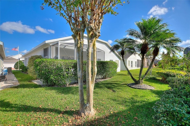 view of yard with a lanai