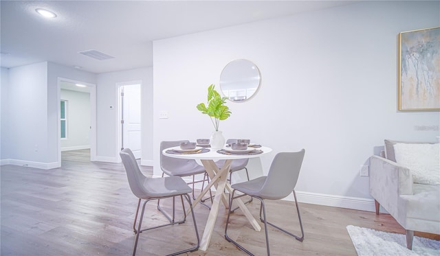 dining room featuring light hardwood / wood-style flooring