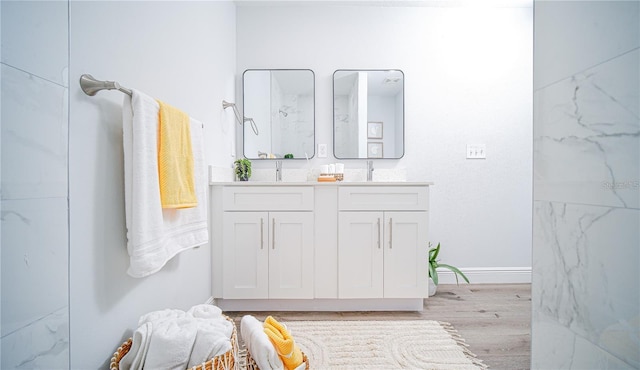 bathroom featuring vanity and hardwood / wood-style flooring