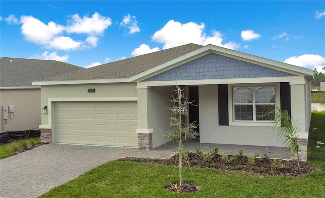 view of front facade with a garage and a front lawn